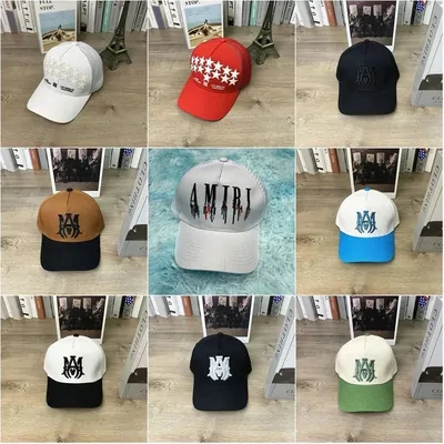 Nine baseball caps in white, red, black and green with embroidered fronts