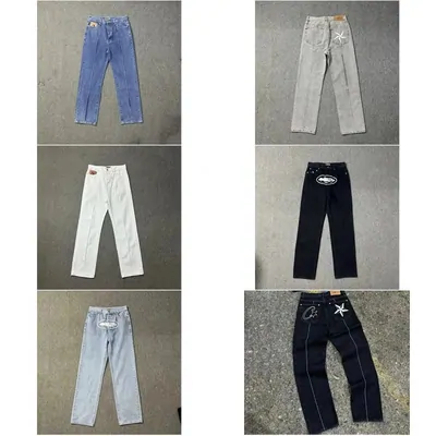 Straight-leg jeans in light wash, white, grey and dark indigo, photographed flat